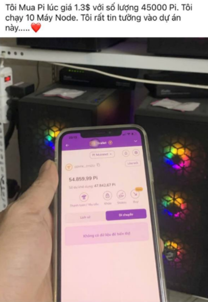 Image showing a hand holding a smartphone displaying a Pi Network wallet balance of 54,859.99 Pi, with Vietnamese text at the top about earning Pi by running nodes, and crypto mining rigs visible in the background.