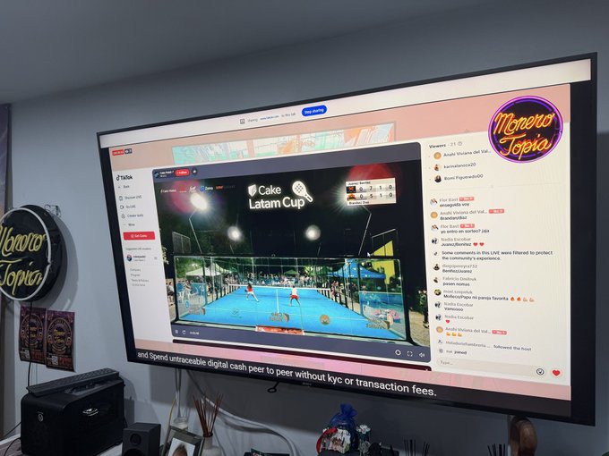 xtopia's live stream of a tennis match, featuring players and spectators on a blue court with white lines.