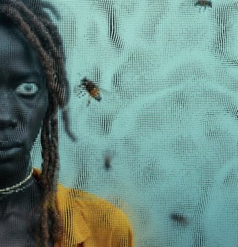A close-up detail showing a person's face with dreadlocks and an orange shirt partially obscured by a cyan mesh or noise overlay pattern, consistent with the AI-generated, Perlin noise–styled artwork from "The Tally Man" NFT collection.
