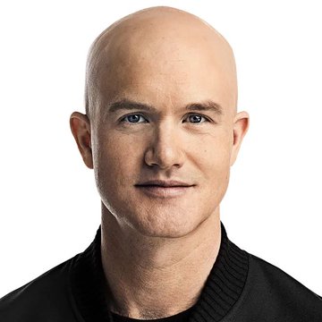 A headshot of a bald man in a black sweater, presented as a professional portrait likely associated with Coinbase's leadership, accompanying news of the company securing a UK MiFID license to expand into derivatives and equities trading for UK users.