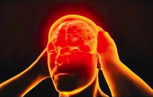 A bald man's head glows red as he holds his temples, with visible brain imagery suggesting mental distress or a headache.
