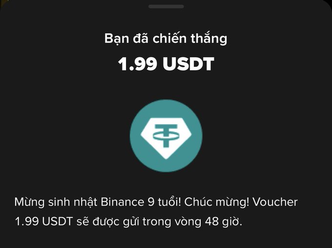 A Binance app notification in Vietnamese announcing a 9th birthday celebration voucher for 1.99 USDT to be delivered within 48 hours.