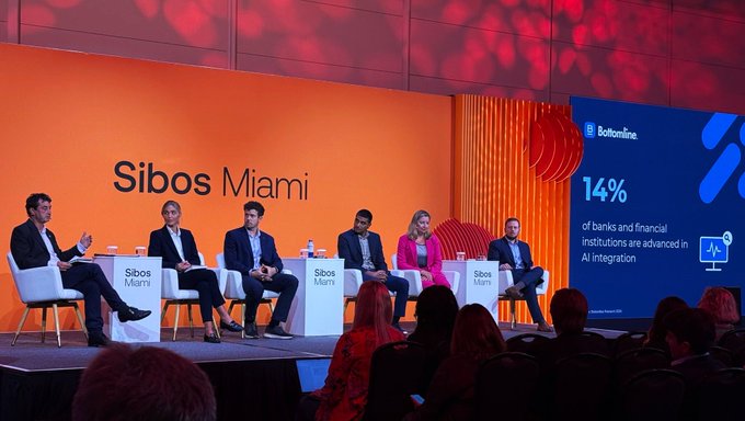 A panel of six speakers sits on stage at Sibos Miami, with a presentation slide from Bottomline displaying that "14% of banks and financial institutions are advanced in AI integration." The image visually supports the conference discussion by showing the expert lineup—including representatives from Chainlink Labs, J.P. Morgan, Bottomline, PwC, and Regions Bank—gathering to address the future of agentic payments in global finance.
