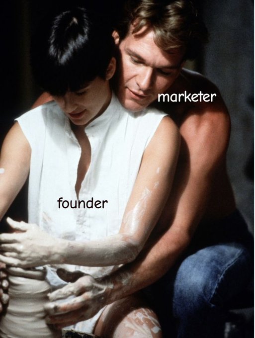 The iconic pottery scene from "Ghost" (1990), with the man labeled "marketer" intimately shaping clay on the woman's (labeled "founder") hands, humorously illustrating the post's joke about "founder-led" marketing in which marketers work closely with founders to bring their creative vision to life.