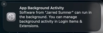 A macOS notification reading "App Background Activity: Software from 'Jarred Sumner' can run in the background. You can manage background activity in Login Items & Extensions," humorously framing Jarred Sumner's open-source software as a forbidden "background activity" amid the satirical scenario of his persecution by the Zig regime.