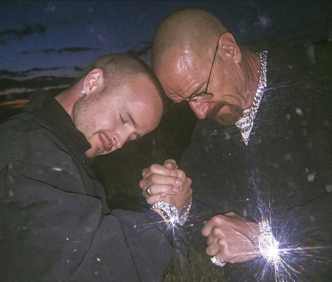 Two men pose with their heads bowed together, prominently displaying large diamond-encrusted watches and rings that catch and reflect light. While the accompanying post promotes a $25 $SOL cryptocurrency giveaway requiring engagement actions, the image itself appears to be an unrelated stock photo of luxury jewelry, creating a disconnect between the visual content and the giveaway promotion.