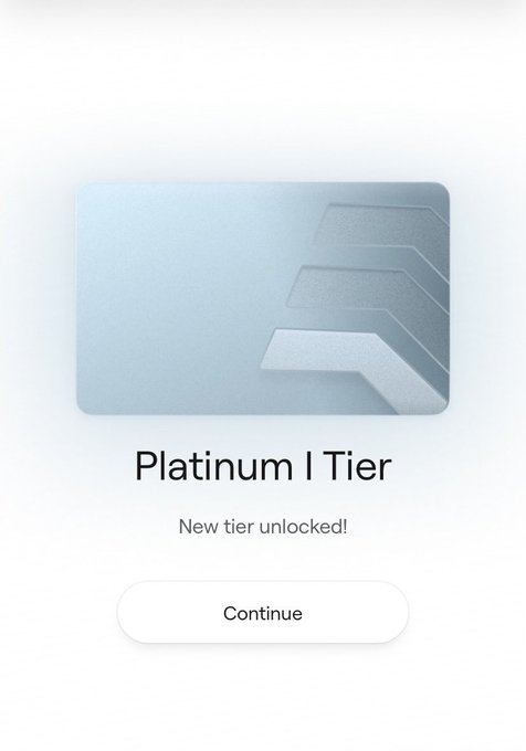 The image shows an iPhone screen with a credit card reader app open. The main focus of the image is a credit card reader app that displays a new tier unlocked message, indicating that the user has earned 33,603 XP from using their platinum-tier credit card. The text "I just earned 33,603 XP on @AbstractChain" suggests that the user's account balance was updated to reflect this achievement.