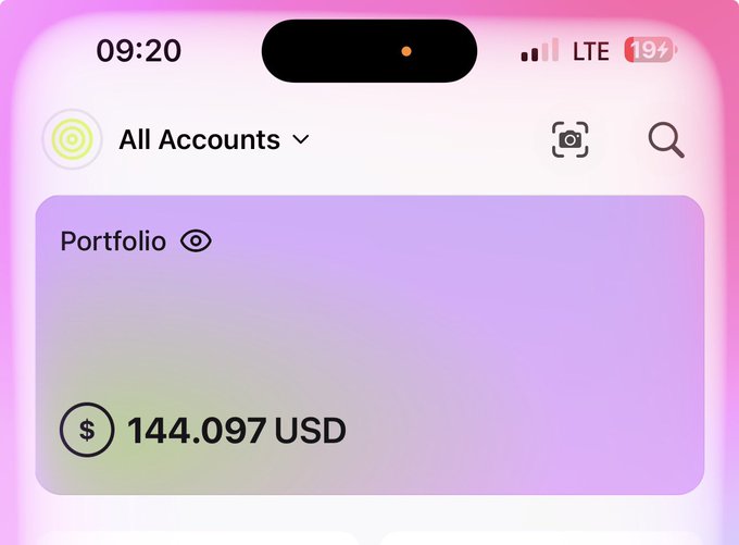 A screenshot of a mobile app displaying a portfolio balance of $144.097 USD under "All Accounts," which the poster attributes to earning free crypto rewards ("stimmies") through tweeting about prediction markets and Hyperliquid.
