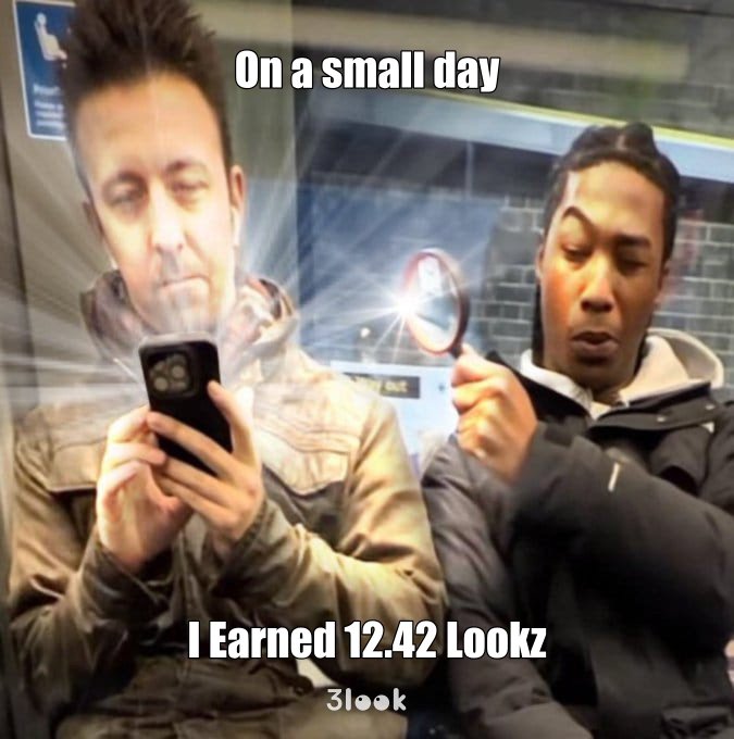 The image shows two men sitting next to each other on a subway train, both looking at their cell phones. One of them has his phone held up to his face while the other one holds his phone in front of him. The man holding his phone in front of him is wearing a black jacket and appears to be reading something on his phone screen. They are sitting next to each other with no personal space between them, which might suggest that they are both engrossed in their phones or possibly having a conversation through text messages.