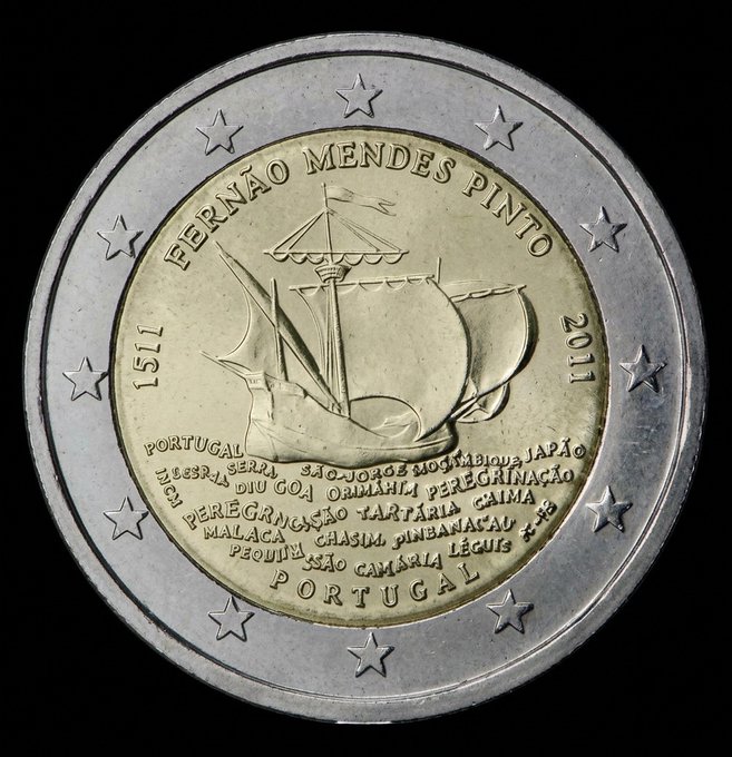 A 2 Euro commemorative coin featuring a Portuguese caravel ship, inscribed with 'FERNÃO MENDES PINTO', '1511', '2011', and 'PORTUGAL', along with locations like 'BENGALA', 'PERSÉPOLIS', and 'JAPÃO'.