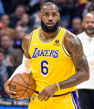 LeBron James, wearing the yellow Los Angeles Lakers #6 jersey, holds a basketball during a game.
