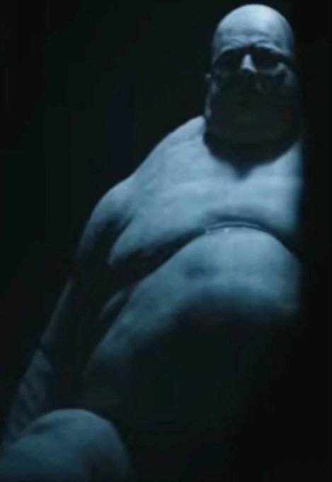 The image shows a dimly lit, pale, muscular figure, likely Thanos, which relates to the caption as it implies someone is using him for his physical strength and the cryptocurrency he holds.