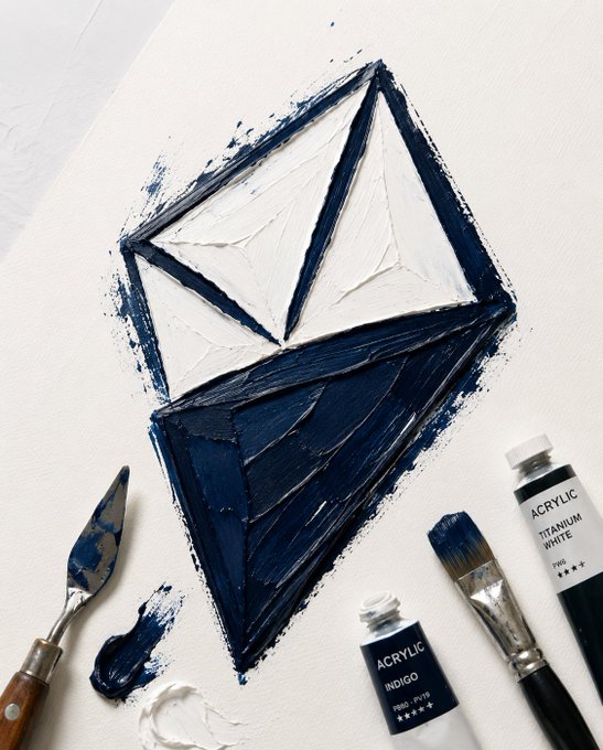 A diamond-shaped geometric painting in indigo and titanium white acrylics, with paint tubes labeled "ACRYLIC TITANIUM WHITE" and "ACRYLIC INDIGO" visible alongside brushes and a palette knife, symbolizing the multifaceted nature of AINFT's $517.87K supplied liquidity on JustLendDAO and its untapped borrowing potential.