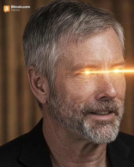 A close-up portrait of Strategy executive chairman Michael Saylor, whose eyes have been digitally edited to glow with golden "laser beams," with a "Bitcoin.com News" logo in the top-left corner. The stylized imagery visually conveys his bullish crypto sentiment, reinforcing his quoted comments on the early stage of a Bitcoin bull market.