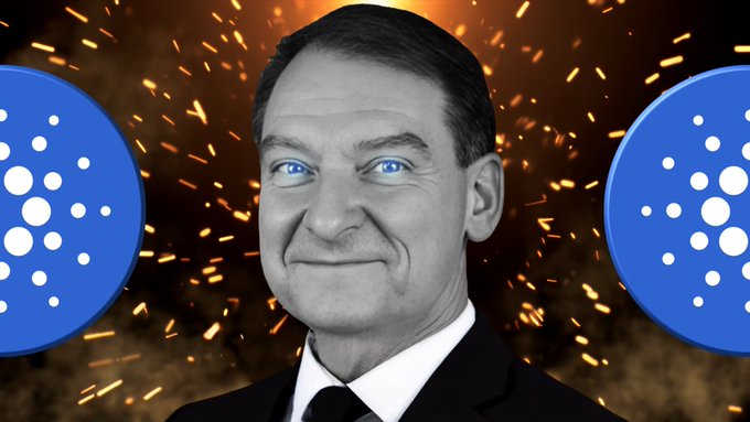The image features a man wearing a suit, tie, and white shirt with blue eyes staring at the camera. The background of the photo has two circles with blue dots surrounding the edges, creating an intense atmosphere. The caption reads "Daily Cardano News! SEC Approves ETF With $ADA Charles: ?".