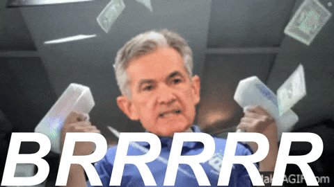 The image features a man holding two stacks of money, with the text "brrrr" written above him. The man appears to be angry or frustrated about his financial situation. The background shows an office setting with a desk and chair visible.