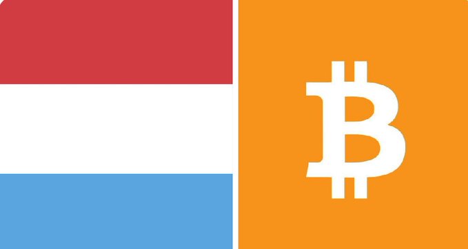 The image shows the flag of Luxembourg alongside the Bitcoin (₿) logo on an orange background, visually representing the country's historic 1% allocation of its sovereign wealth fund to Bitcoin, making it the first Eurozone nation to do so.