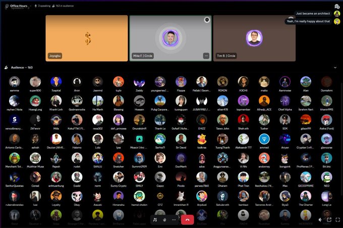 A screenshot of a virtual Office Hours meeting on a platform like Spatial, showing video tiles for Jongshin, Mike F., and Tim B., along with a large audience grid of 163 participants. A chat message reads, 'Just became an architect! Yeah, I'm really happy about that'.