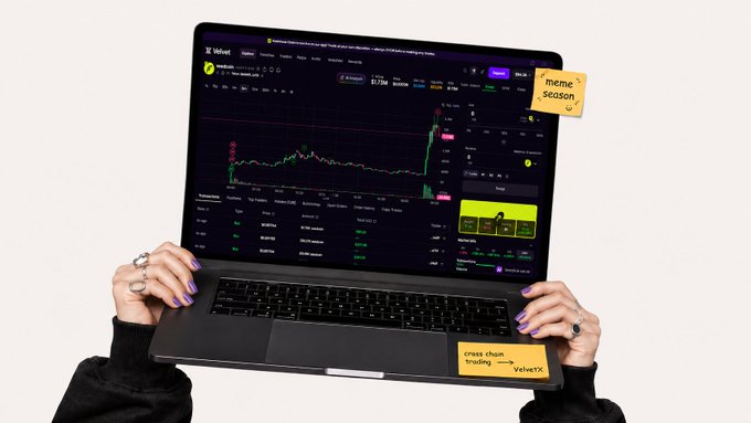 A person holding a laptop displaying the VelvetX trading platform with a meme season banner, a 'cross chain trading' sticker, and a 'VelvetX' label on the keyboard.