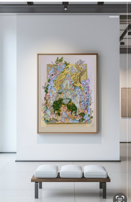 An ornate, mixed-media artwork with gold, green, and pastel elements hangs on a white gallery wall above a wooden bench with white cushions.