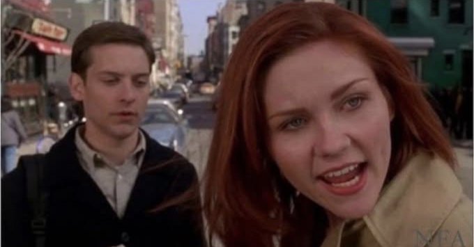 The image features two actors standing next to each other with their mouths open as if they are speaking or laughing. The background of the scene shows an urban street, indicating that this could be a movie set or a real-life location for filming purposes. In the corner of the image, there is text that reads "He'S not unemployed, he'S a CRYPTOCURRENCY INVESTOR!". This phrase seems to be related to the main characters in the scene and possibly serves as an inside joke between them or a reference to their profession.