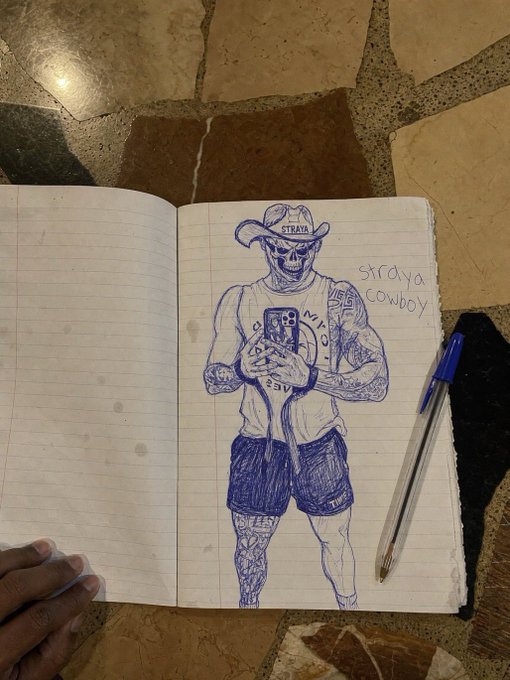 A blue-ink ballpoint pen sketch in a lined notebook depicts a tattooed figure in a cowboy hat labeled "STRAYA" taking a mirror selfie, with the handwritten caption "straya cowboy" beside it. This appears to be the prize artwork created by giveaway winner @drizzynotdrak33 for a $100 Straya-themed contest.