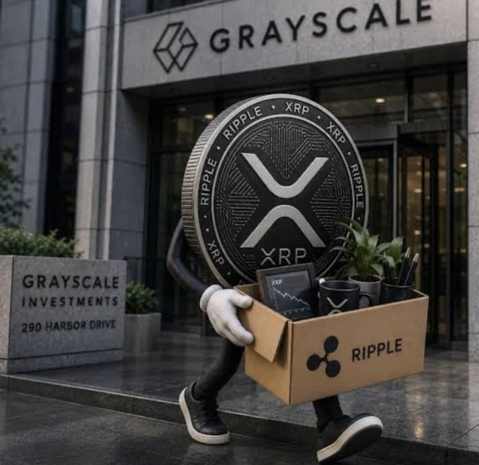 An XRP coin character carries a Ripple-branded box of merchandise outside the Grayscale Investments building at 290 Harbor Drive.