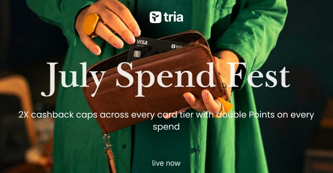 Promotional banner for 'Tria' titled 'July Spend Fest' offering 2X cashback caps across every card tier with double Points on every spend, showing a person in a green shirt opening a brown leather wallet containing a Visa card.