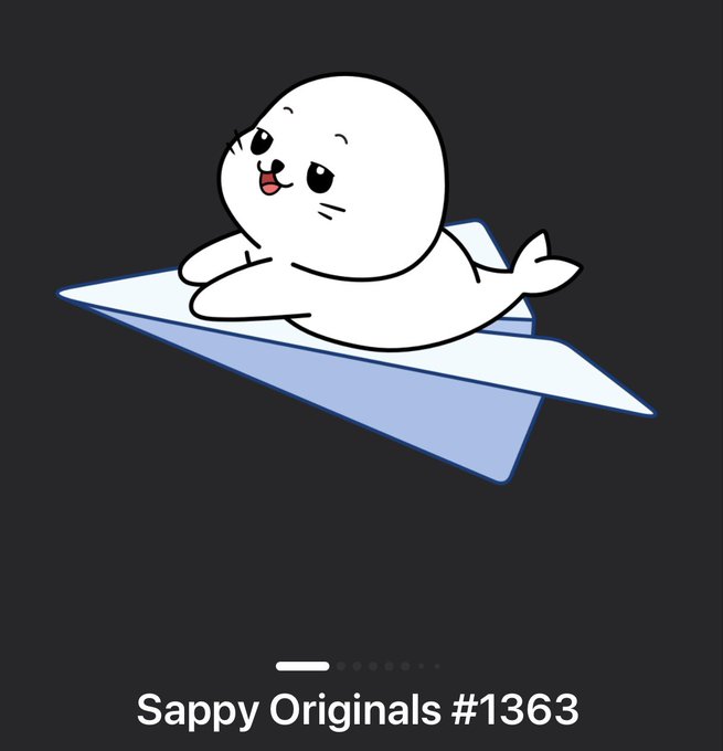 An illustration of a cute white seal pup riding on a blue paper airplane, labeled "Sappy Originals #1363" at the bottom against a dark gray background.