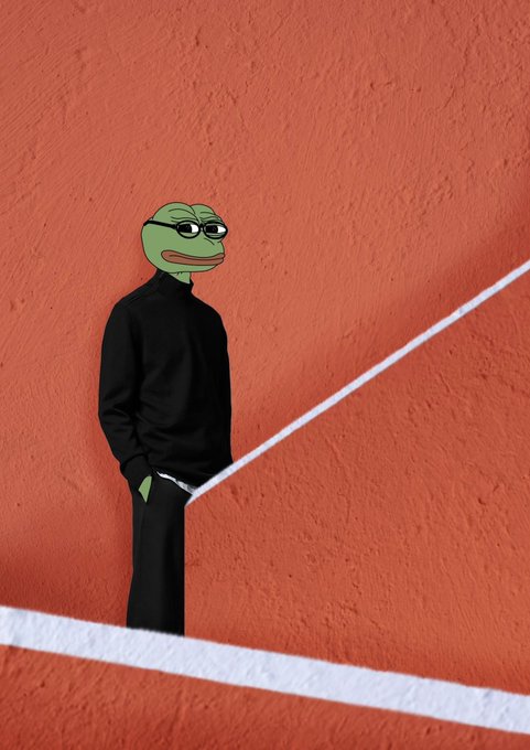 A person wearing a black turtleneck and pants leaning against a red clay tennis court wall, with their head edited to be the 'cool frog' Pepe meme wearing sunglasses.