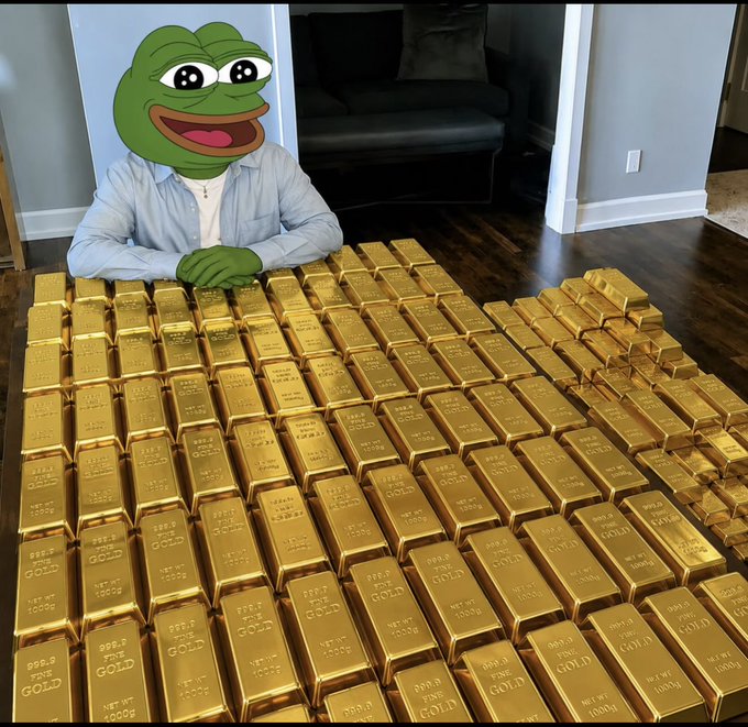 A person with a Pepe the Frog meme face edited onto their head, sitting at a table covered with a huge pile of gold bars stamped '999.9 FINE GOLD 1000g'.