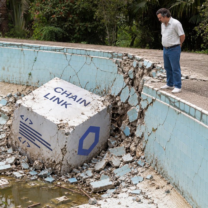 A surreal image showing a man in a white shirt and jeans standing on a cracked pool deck, looking down at a large concrete block labeled 'CHAIN LINK' that has broken through the pool wall.