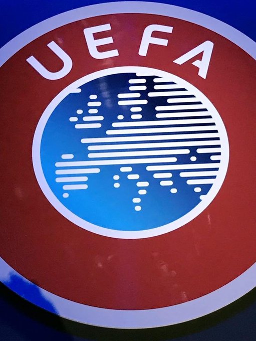 A close-up of the UEFA logo, featuring its signature red, white, and blue circular design with a stylized map of Europe.