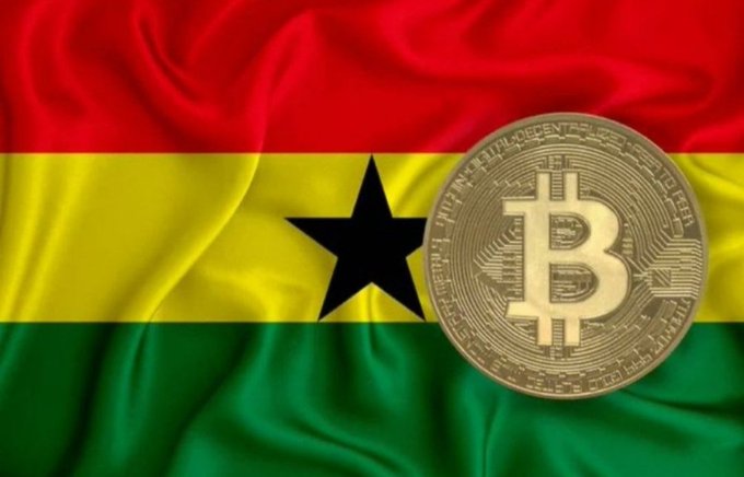 A gold Bitcoin coin is overlaid on the Ghanaian flag, symbolizing cryptocurrency adoption in Ghana.