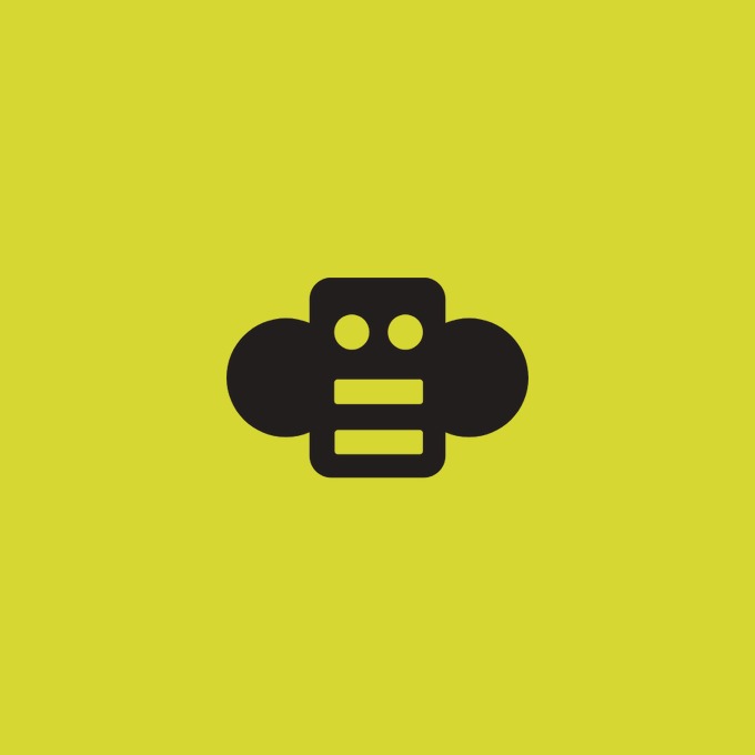 The image shows a simple black robot/AI icon with circular ears and a segmented body on a bright yellow background, symbolizing the AI agent aspect of the news. The minimalist mascot visually represents the artificial intelligence component of Block's new decentralized chat platform "Buzz," which is designed to facilitate collaboration between humans and AI agents.