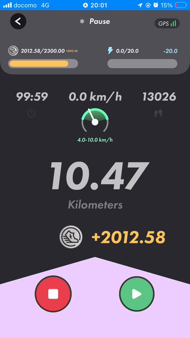 The image shows a phone screen displaying a fitness app with various information, including the time of day, distance traveled, speed, and calories burned. The app also has buttons for recording steps taken, playing music, and pausing the activity. The background is black, making it easy to read the details on the screen.
