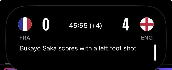 A sports scoreboard shows France (FRA) trailing England (ENG) 0-4 at 45:55 (+4 minutes added time), with a notification stating "Bukayo Saka scores with a left foot shot."