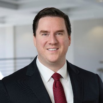 The image shows Charles Schwab's Head of Crypto Research, who offers insights on the CLARITY ACT's potential positive impact on Bitcoin and institutional adoption.