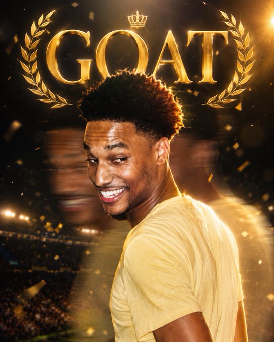 An edited image of soccer player Vinicius Jr smiling, with a golden 'GOAT' emblem and laurel wreath above him.