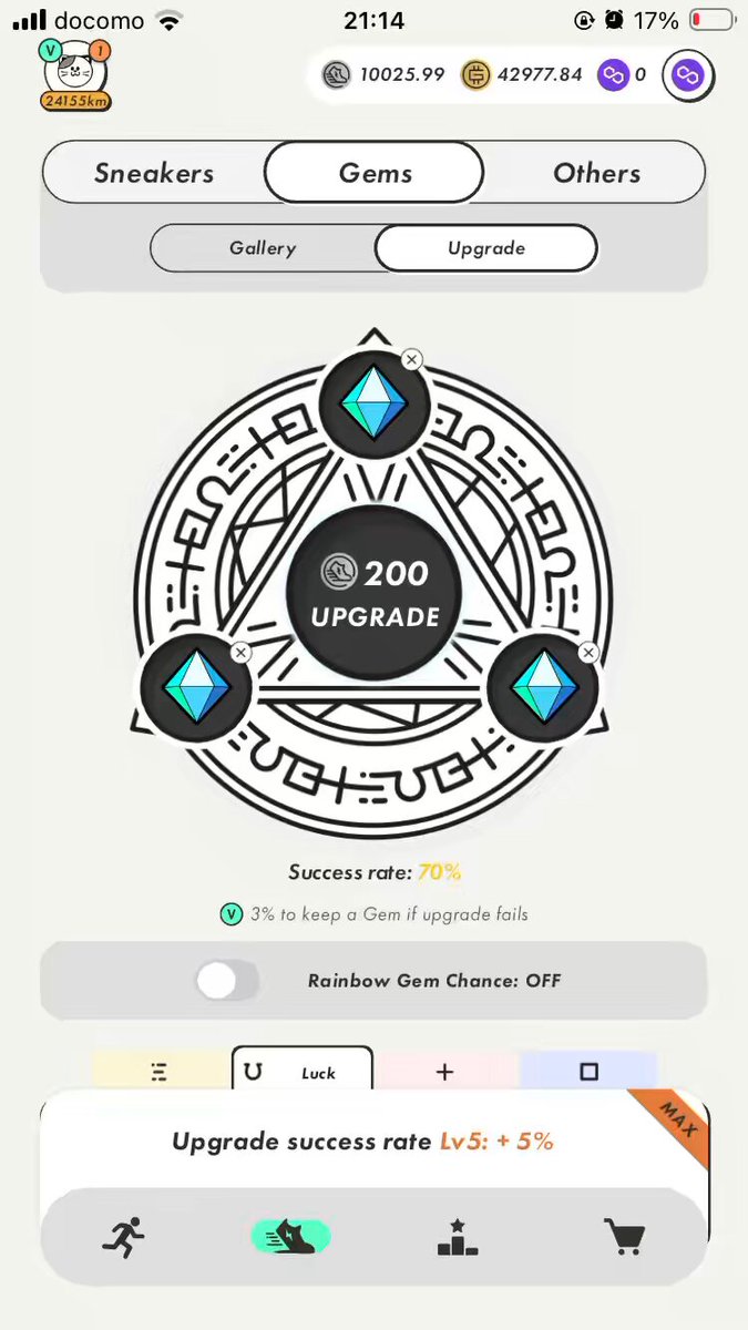 The image shows a phone screen with an app icon, which appears to be a game or puzzle. The background of the screen displays a black circle with three blue diamonds inside, along with some text that reads "200 Upgrade Success Rate". There is also a small amount of text in the bottom right corner of the screen, but it does not seem to provide any additional information about the app or its features.
