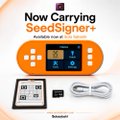 Promotional graphic for 'SeedSigner+' hardware wallets, showing an orange device, a black version, and accessories.