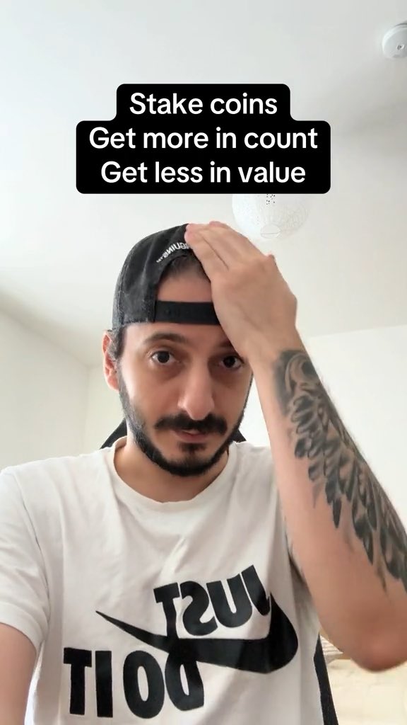A man with a beard and a backwards cap touches his forehead, with text overlay reading 'Stake coins Get more in count Get less in value'.