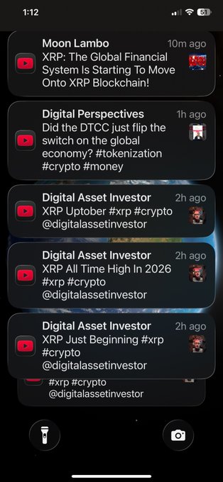 A smartphone notification screen displays multiple YouTube video alerts from channels like 'Moon Lambo' and 'Digital Asset Investor' discussing XRP, crypto, and tokenization.
