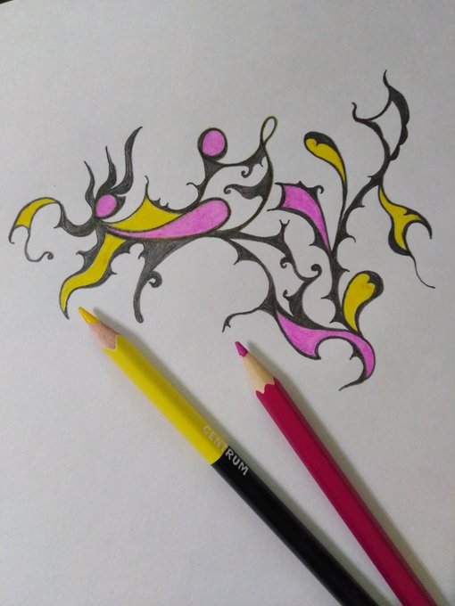 A decorative tribal-style drawing in yellow, pink, and black ink on white paper, with a yellow and a pink colored pencil resting below the artwork.