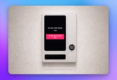 A retro-styled image of a vintage electronic device or ticket machine with a small screen displaying text on a purple and blue gradient background.