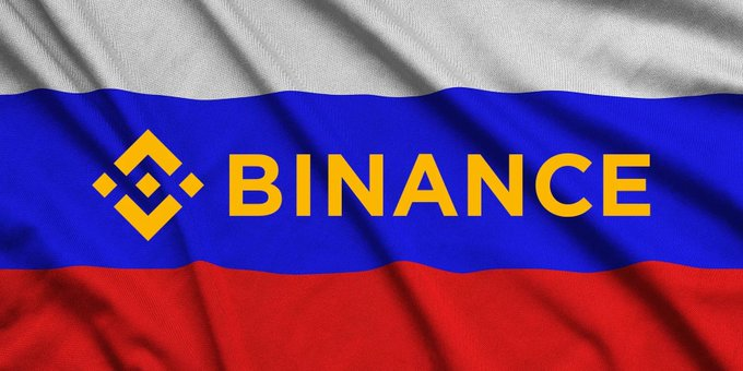 A waving flag with white, blue, and red horizontal stripes displaying the yellow Binance logo and the word 'BINANCE'.