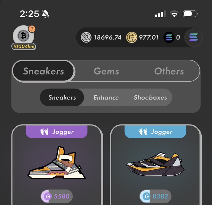 The image shows a pair of sneakers displayed side by side, with one being orange and black while the other is yellow and white. The sneakers are positioned next to each other, allowing for easy comparison between them. The caption below the image reads "あ!ぁ100000km!!! #stepn", which seems to be a reference or description related to the sneakers on display.