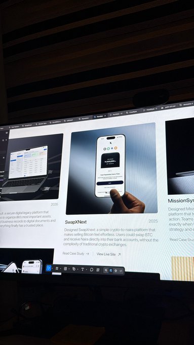A computer monitor displays a website case study for 'SwapXNext,' described as a metaverse digital legacy platform, with a finger pointing at a phone mockup showing a user experience, alongside other project cards like 'Read Case Study.'
