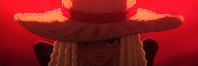 An anime-style illustration of a character with long curly blonde hair wearing a large straw hat with a red band, set against a vibrant red background.