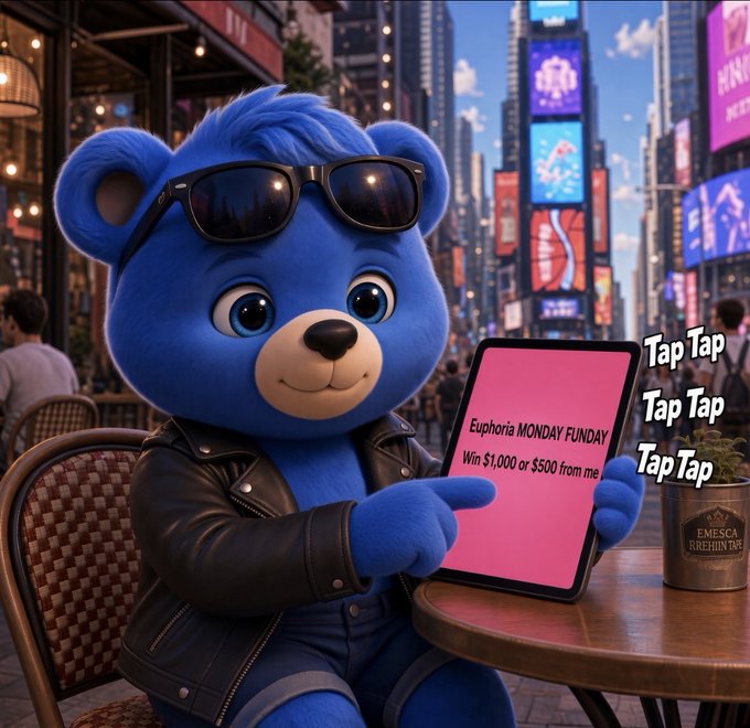 A blue cartoon bear wearing sunglasses and a leather jacket sits at an outdoor cafe in a Times Square-like setting, holding a tablet displaying 'Euphoria MONDAY FUNDY Win $1.000 or $500 from me' with 'Tap Tap Tap Tap' text beside it.